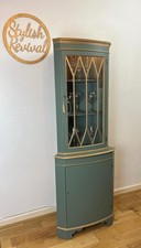 Spray painted drinks display corner cabinet green