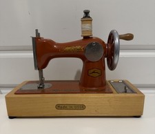 VINTAGE  SOVIET USSR MINI CHILDRENS SEWING MACHINE TOY 1980s ORANGE METAL