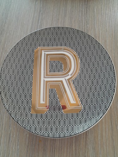 Next tea plate with - tea, initial