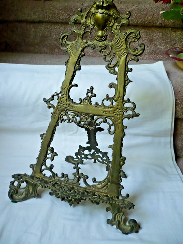 Ornate old brass book stand - ornate,