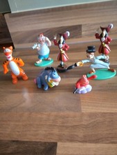 Collection of 7 Disney hard Plastic figures peter pan, winnie the pooh etc