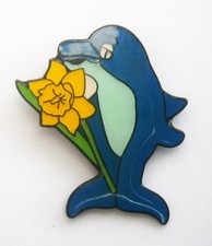 N892) Vintage enamel dolphin holding yellow daffodil flower badge pin