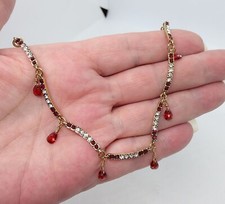 MONET Gold Tone Red Crystal