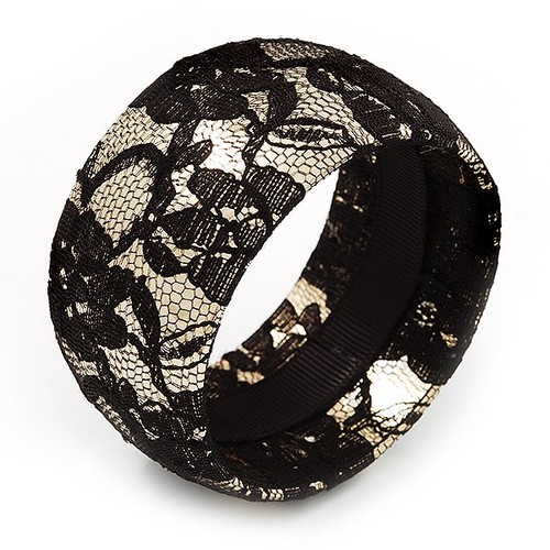 Gold tone bangle with black - tone,