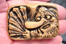 A Japanese boxwood  TABLET netsuke, showing Tengu, the long nose demon