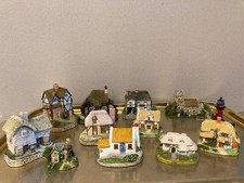 Collectable miniature ceramic cottages, pubs, lighthouse and church 