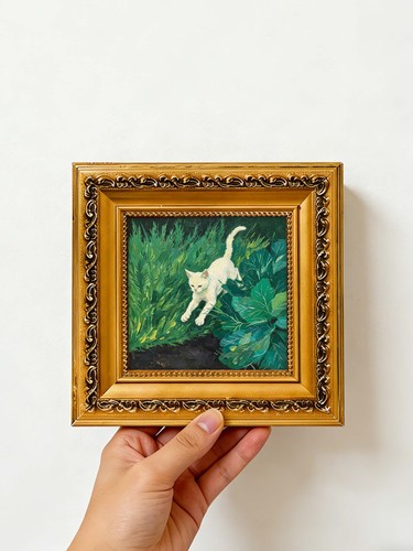 White kitten leaping through - white,