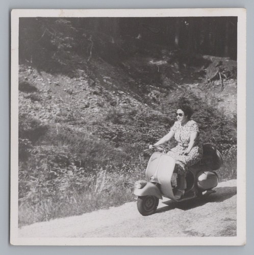 Woman scooter vespa - on,