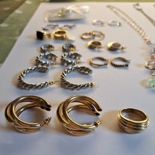 A job lot of jewellery.earrings rings necklaces. Next, Claires.