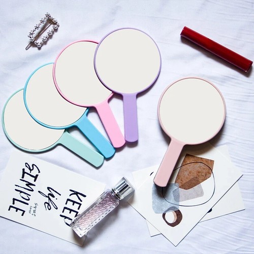 Hand held round makeup - hand,