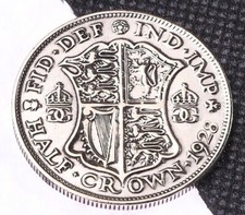 Polished half crown coin - half,