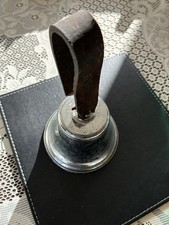 Vintage chrome hand bell dated on strap nice loud ding