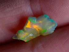 Fire Opal ON BLACK  Welo Opal 2.25Cts. Multicolored Rare Gem Natural Rough form.