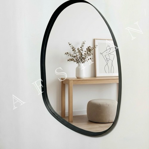 Black oval wall mirror - wall,