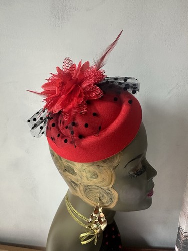 Red fascinator with flower and - with,