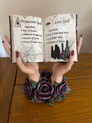 Halloween hands holding spell - holding,