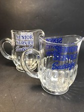 PAIR VINTAGE HEAVY GLASS SENIOR SERVICE SATISFY ADVERTISING PUB BAR WATER JUGS