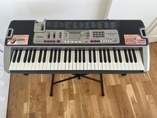 Keyboard Casio Lk-210 with power adapter, stand and music stand