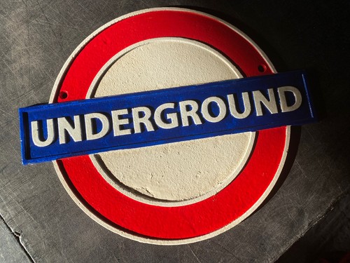 Underground cast iron sign
