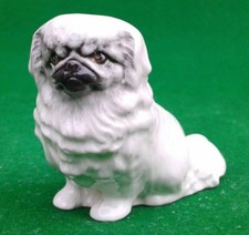 BRANKSOME CHINA SEATED PEKINGESE DOG - UNUSUAL COLOURWAY.