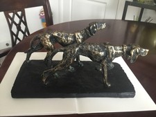 Antique bronze dogs on a slate