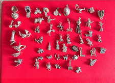 SILVER CHARMS - VARIOUS STYLES AND DESIGNS - UNMARKED SILVER , FROM NANS BRACELE