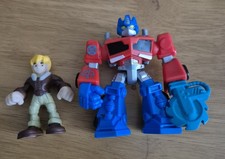 Playskool Transformers Rescue Bots Cody Burns and Optimus Prime action figures.