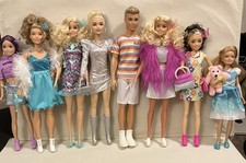 A Variety Of Used Barbie And