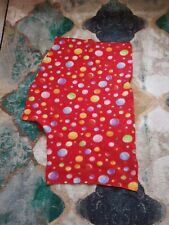 Piece of fleecy material, red with coloured bubbles