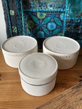 3 cream round Pandora jewellery boxes. 2 large and 1 small (zipped)