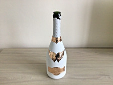 White Angel Champagne bottle with rose gold aluminium plated labels