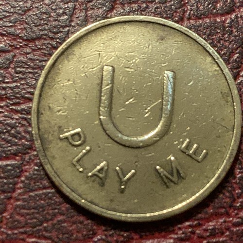 Vintage play brass token - u,