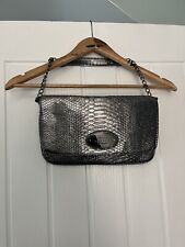 Woman’s Jonathan Kelsey Metallic silver bag with little Chain handle