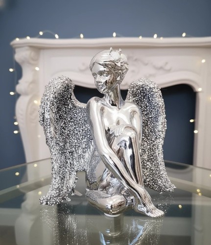 Sitting angel with - sitting,