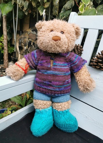 Hand knitted teddy bear - hand,