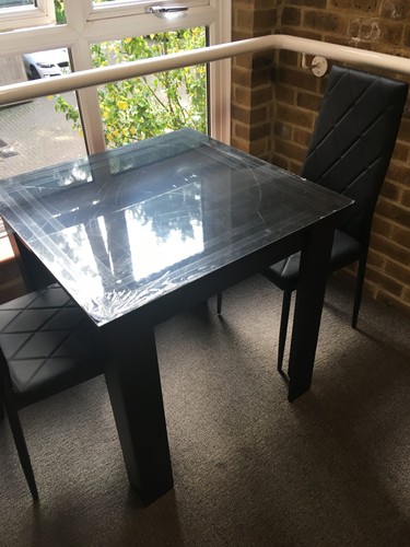 Dining table and two chairs