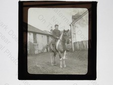 Youth on Piebald Horse Pony