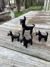 FOUR MINIATURE BLACK GLASS