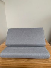 Tablet cushion stand, grey. Pockets at the back and sides.
