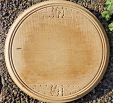 ANTIQUE CARVED BREADBOARD IN A