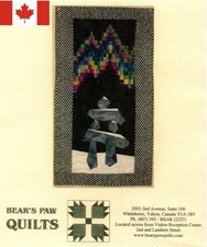 INUKSHUK WITH NORTHERN LIGHTS