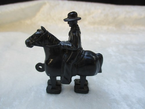 Vintage black plastic cowboy - black,