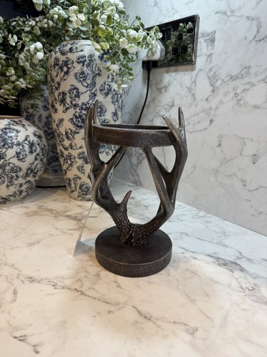 Next bronze antler pillar - next,