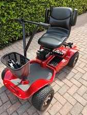single seat ride on golf buggy, complete with ramps for car boot access. 