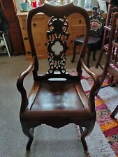 Chinese 20th Century Rosewood Armchair With A Carved Wood Back And Central Hards