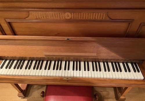 Brown wood upright piano with - upright,