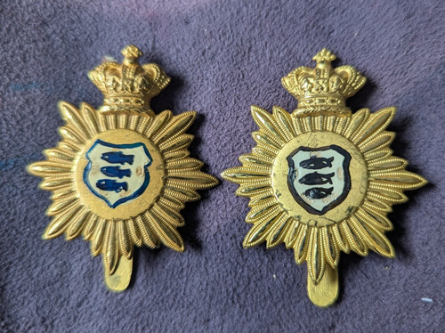 Two brass cap badges made - two,
