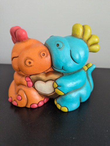 Thun hugging dinosaur statue - thun,