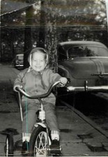 Little Girl On Tricycle