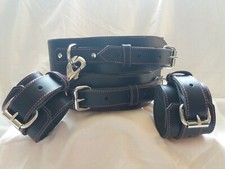Bondage Wrist Bound To Thigh